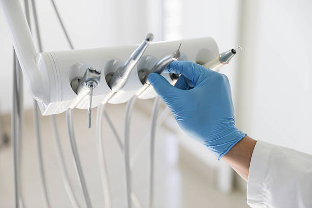 Professional Tooth Extraction technician working in Creve Coeur, MO